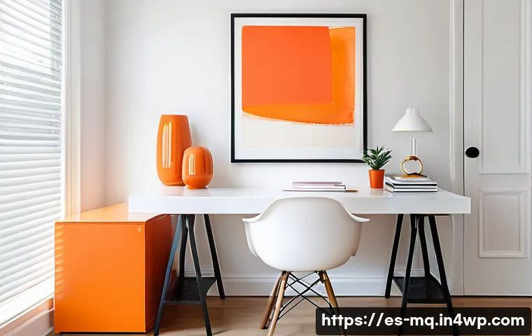 컬러테라피를 활용한 집중력 향상 방법 - A modern home office interior featuring a white wall with a single large vibrant orange abstract pai...